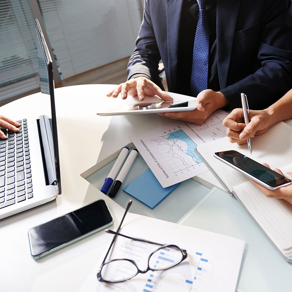 business people sitting at office desk working project